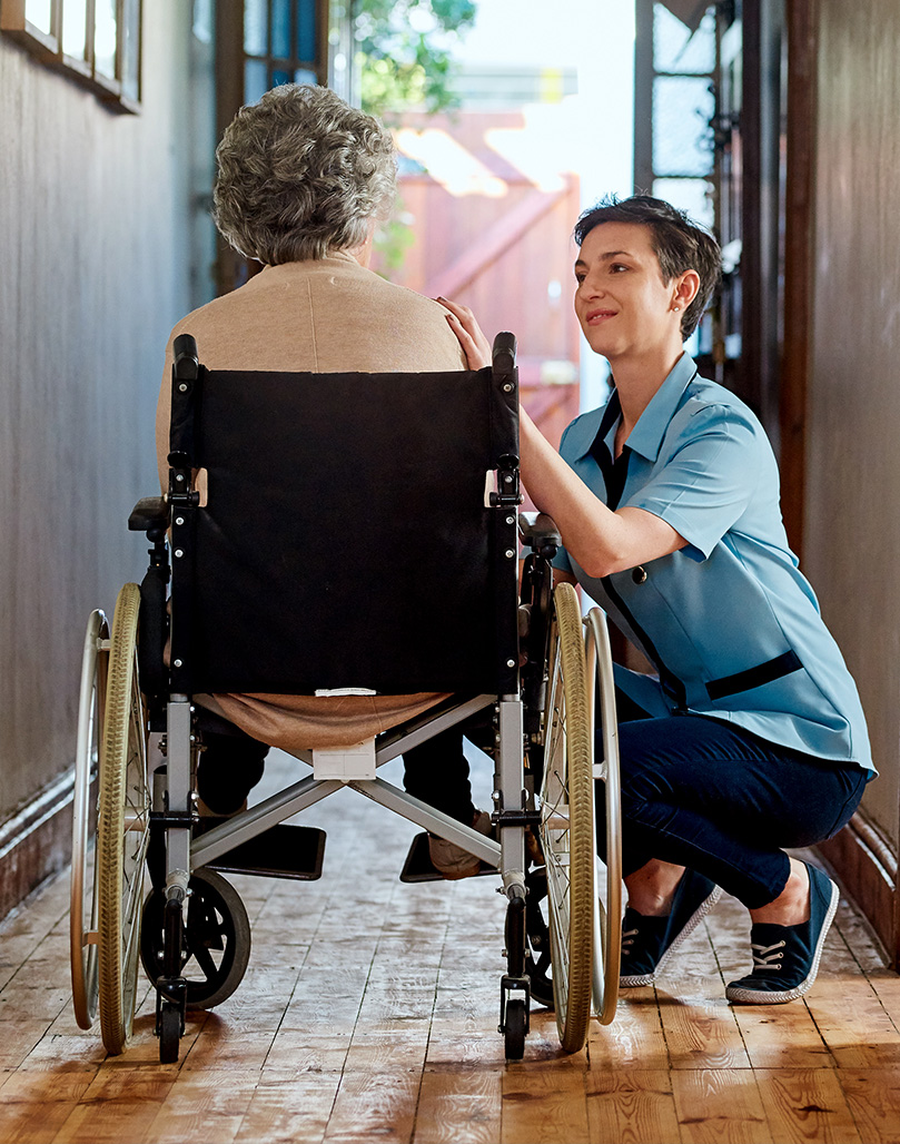 Carer mobile A carer and elderly wheelchair user